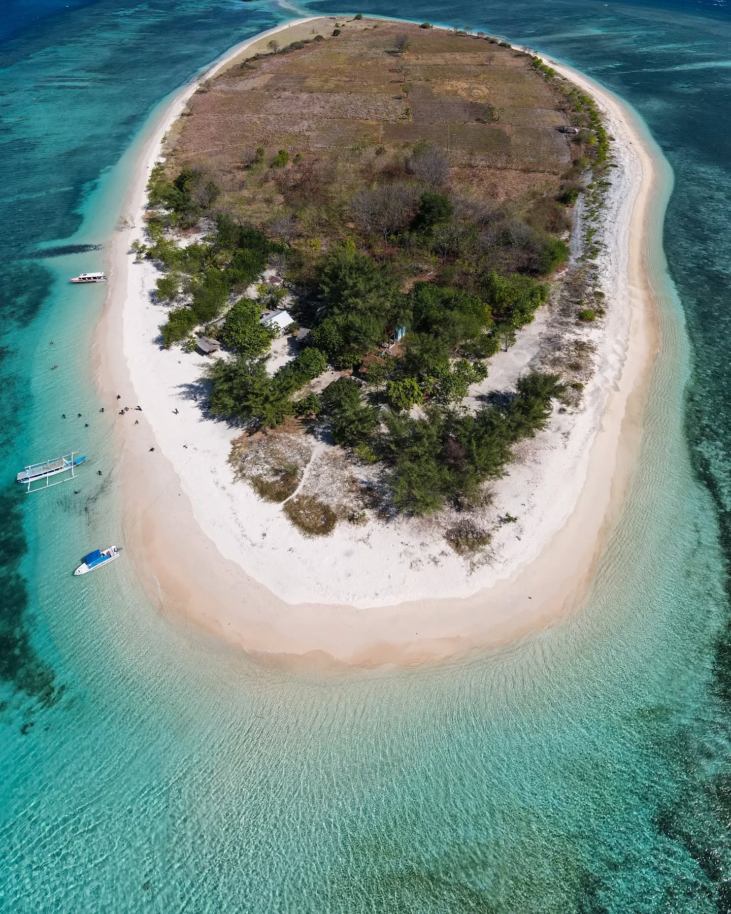 Pristine beaches and coral reefs around Gili Kondo