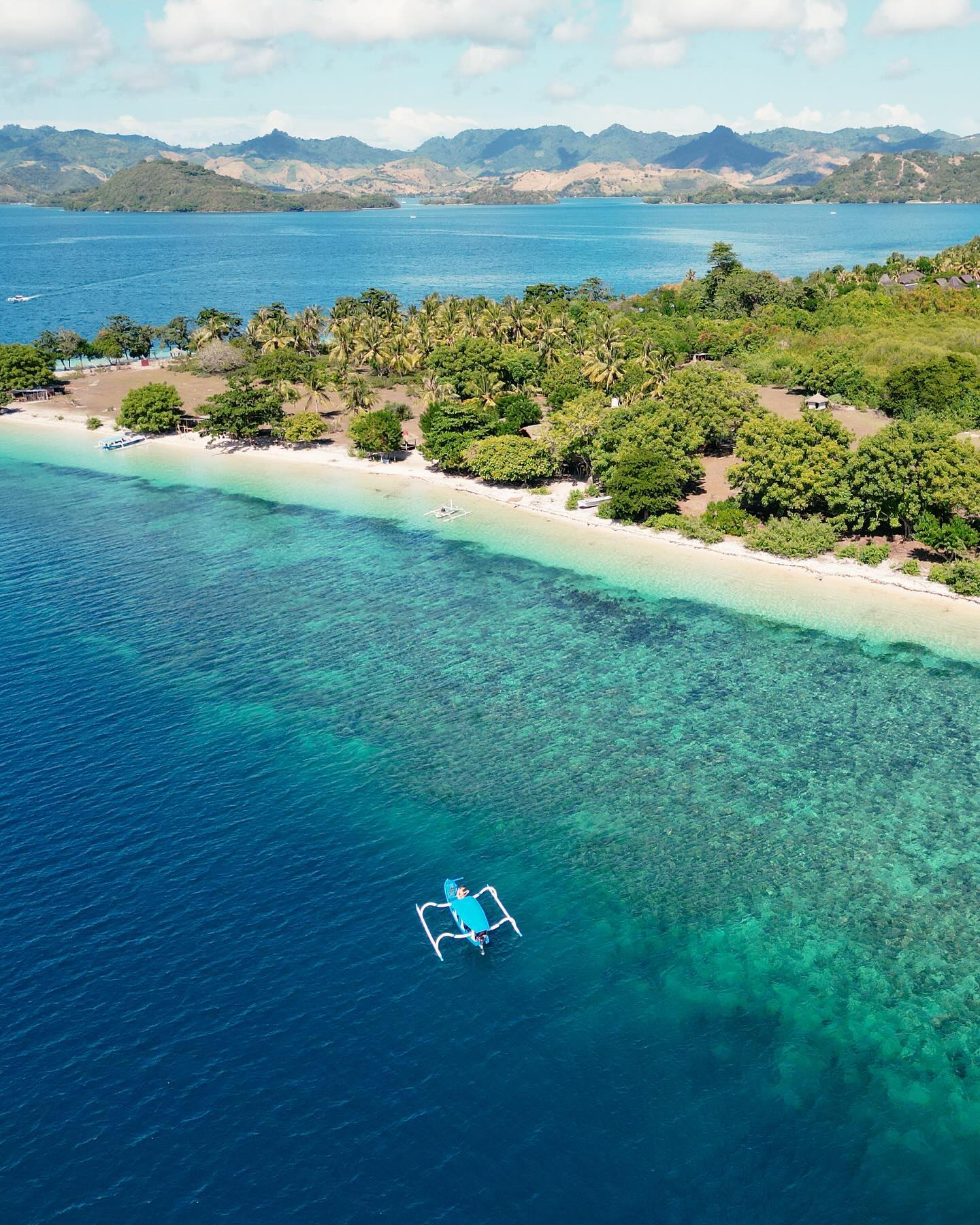 Crystal clear waters with vibrant coral reefs and tropical fish