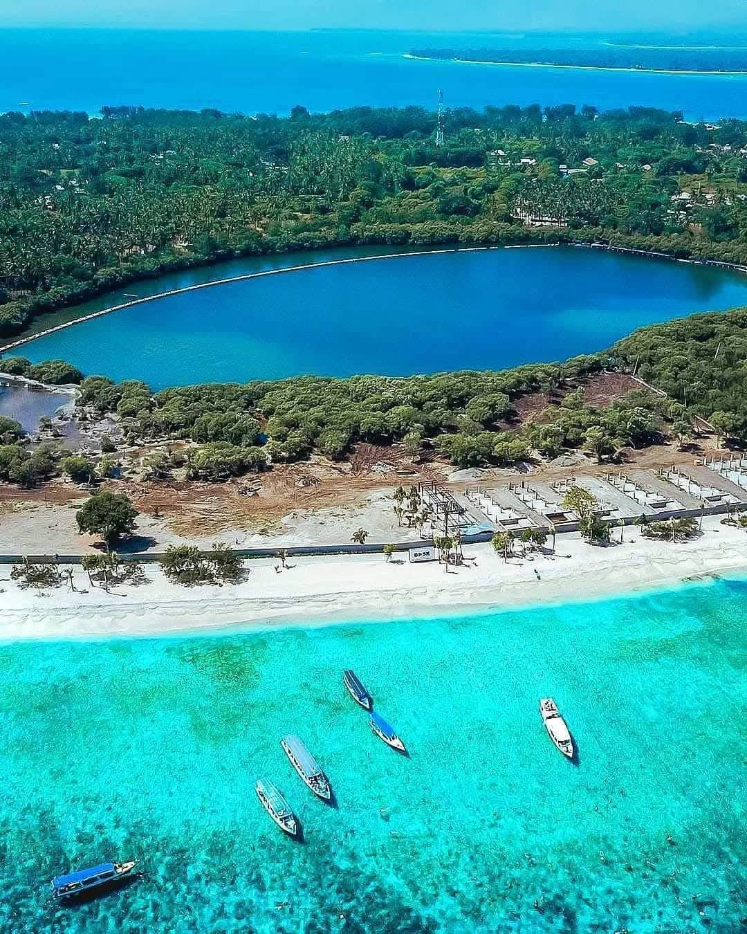 Crystal clear waters with vibrant coral reefs and tropical fish
