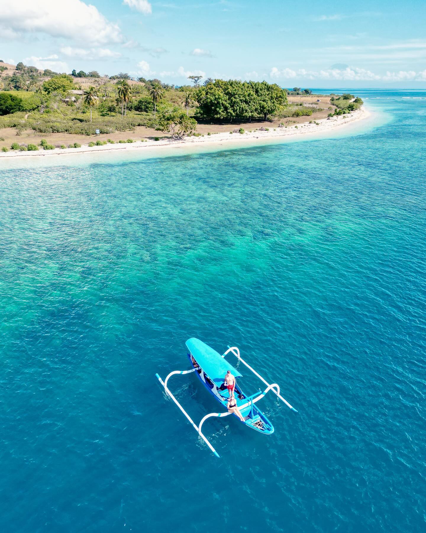 Three beautiful tropical islands with white sandy beaches and palm trees